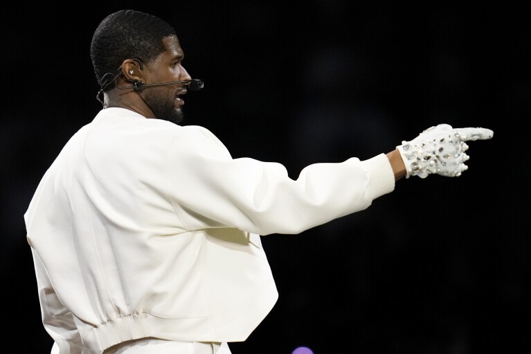 Usher performs during halftime of the NFL Super Bowl 58 football game between the San Francisco 49ers and the Kansas City Chiefs on Sunday, Feb. 11, 2024, in Las Vegas. (AP Photo/Ashley Landis)