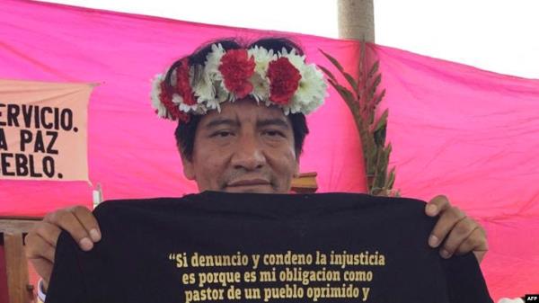 FILE - Undated picture of Catholic priest Marcelo Perez showing a T-shirt during an activity in San Cristobal de Las Casas, Chiapas state, Mexico.