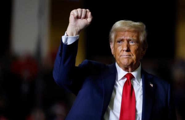 Trump gestures at a campaign rally at The PPL Center on October 29, 2024 in Allentown, Pennsylvania.