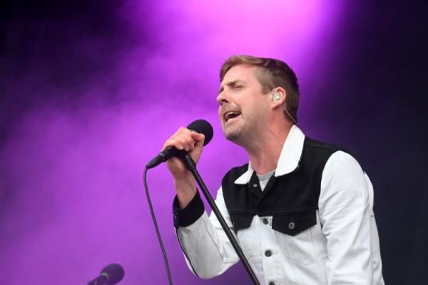 Ricky Wilson of the Kaiser Chiefs sings into the microphone during Latitude Festival 2021