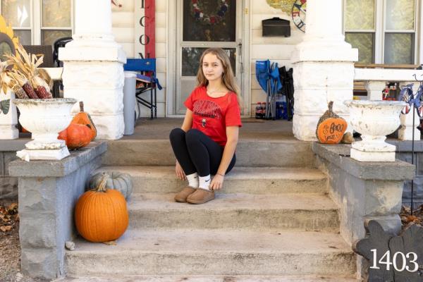 Logansport high school student Cheyanne Baker sits on her front porch