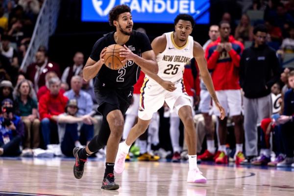 Nets forward Cameron Johnson (2) brings the ball up court against New Orleans Pelicans guard Trey Murphy III (25) during the first half at Smoothie King Center. 